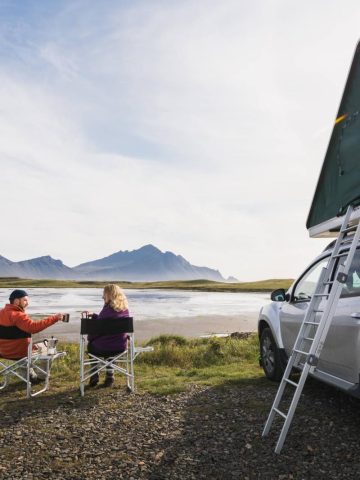 people in campervan in Iceland - how to save money in iceland