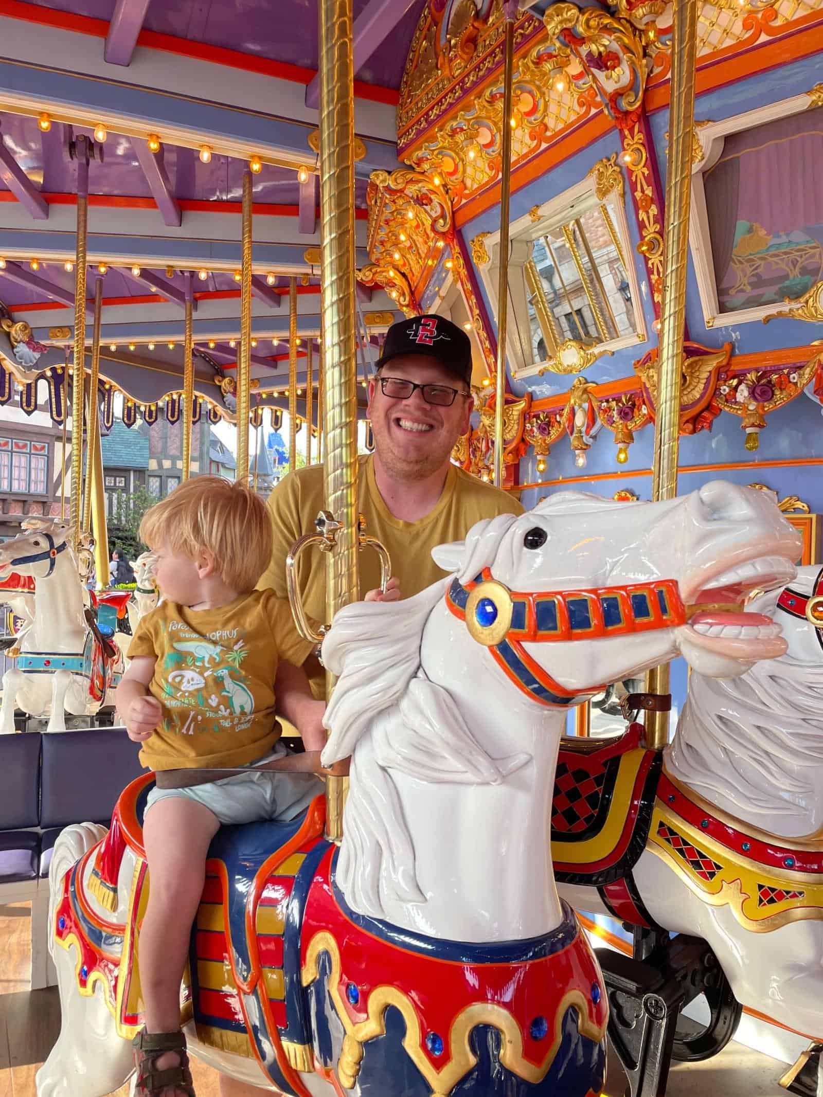 Toddler on a carousel - a must for a Disneyland itinerary for toddlers