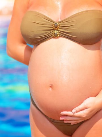 Pregnant woman by pool
