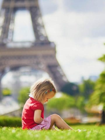 Toddler in Paris in front of Eiffel Tower