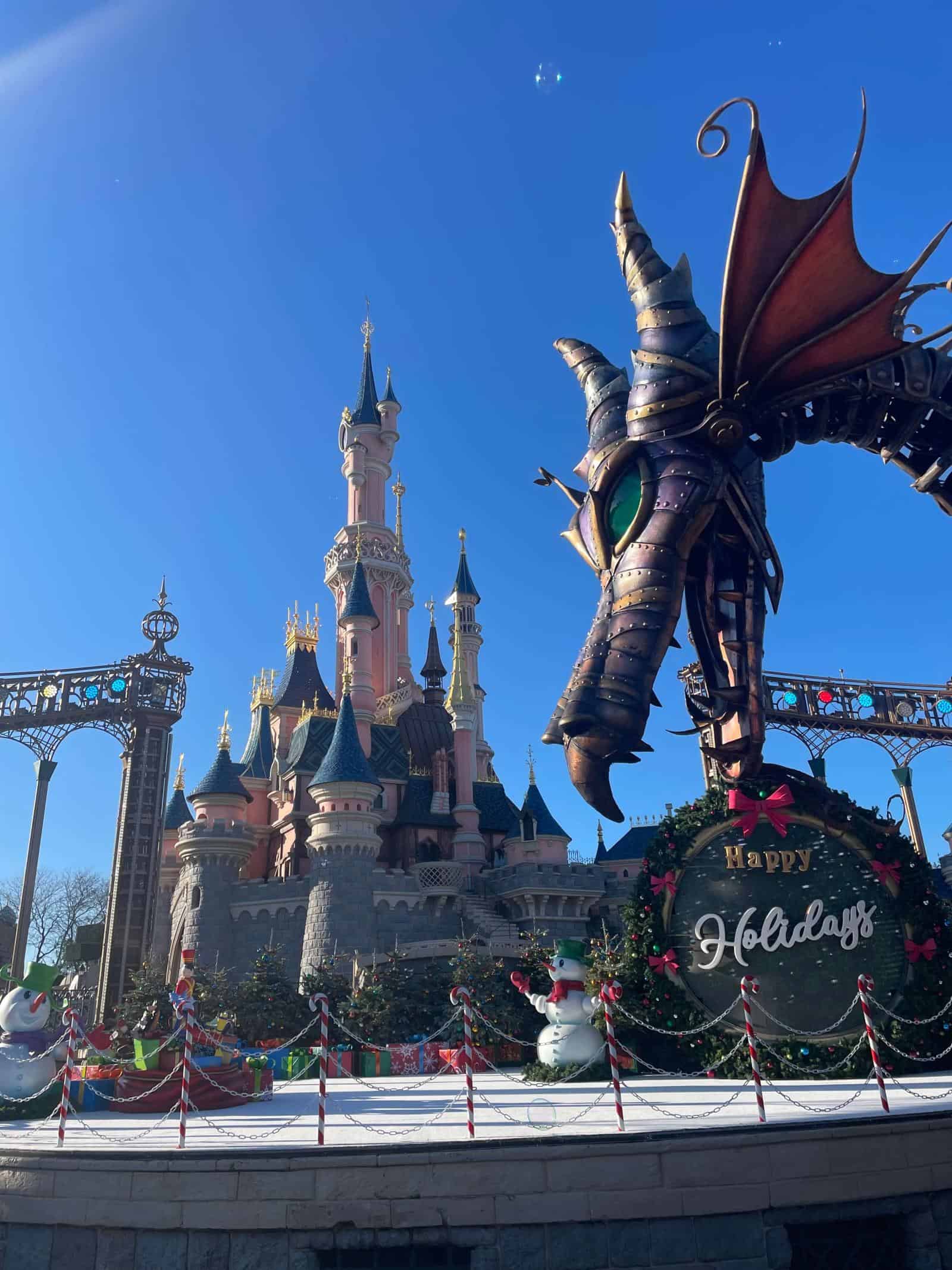 Dragon parade float with disneyland paris castle in background