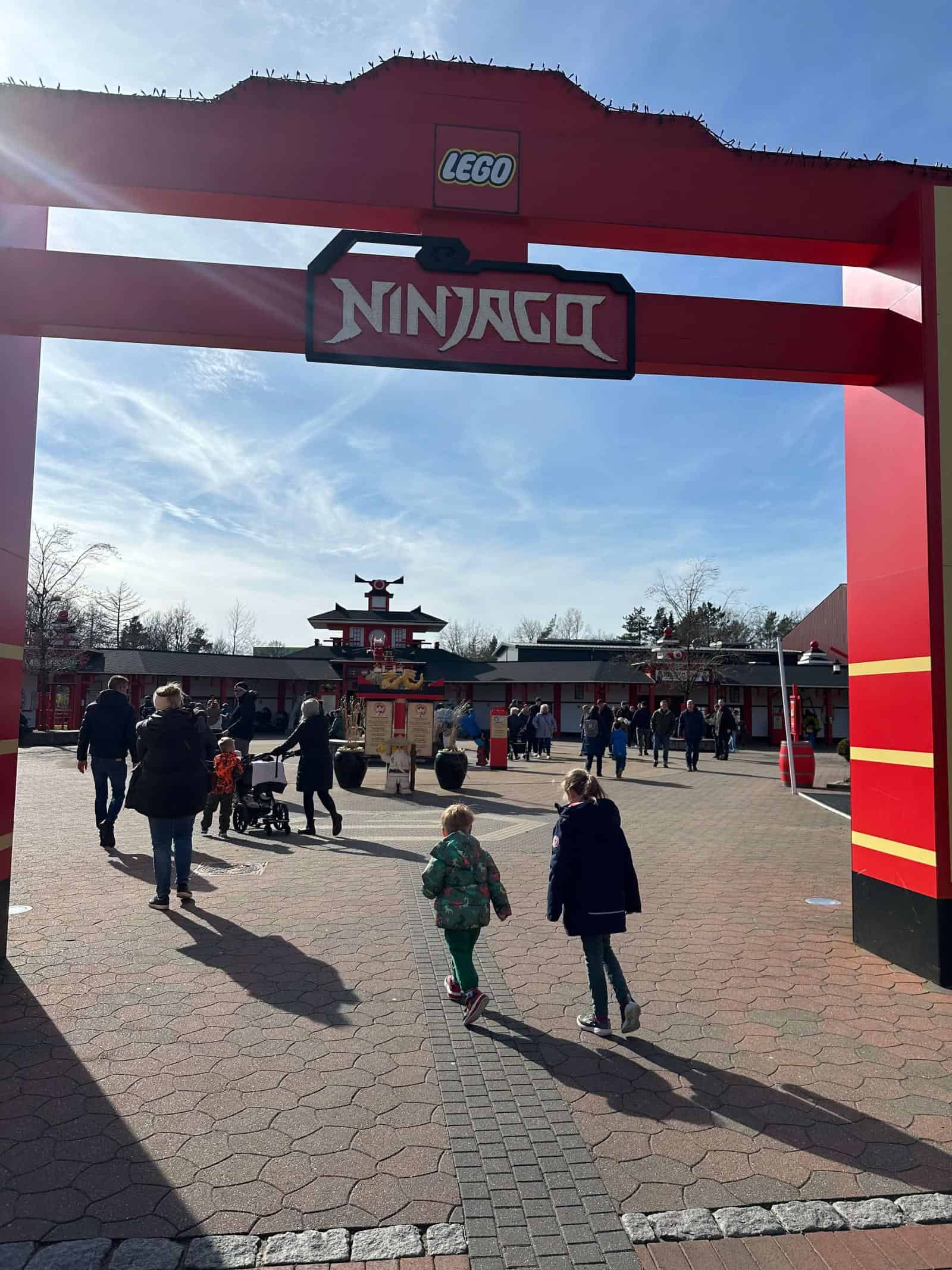 two children entering the Ninjago area of Legoland Billund